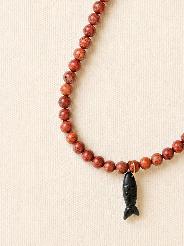 le collier poisson noir